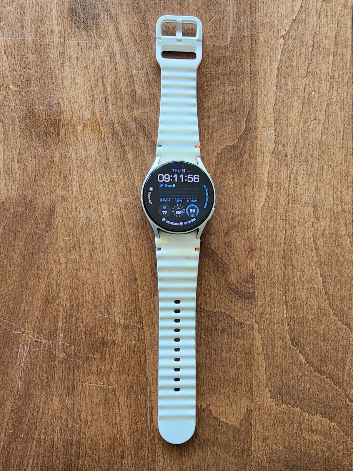 Samsung Galaxy Watch 7 on a wooden table - a recognizable timer.